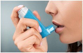 Person using an inhaler