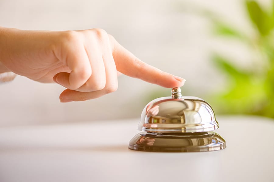 BCOH Hand of guest ringing in silver bell