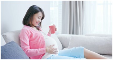 BCOH Sleep and Pregnancy Blog - Pregnant woman on a couch
